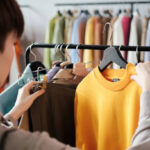 Girl choosing dress to wear