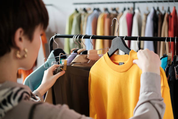 Girl choosing dress to wear